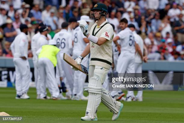 Australia's Steven Smith reacts as he walks back to the pavilion after losing his wicket for 34 runs on day four of the second Ashes cricket Test...