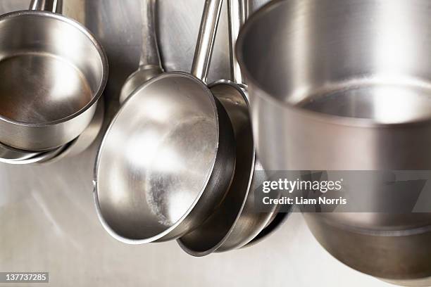 close up of stainless steel pans - rostfritt stål bildbanksfoton och bilder