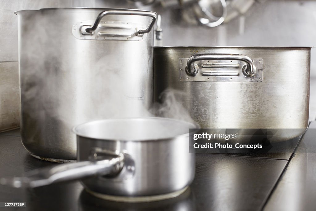 Pots boiling on stove