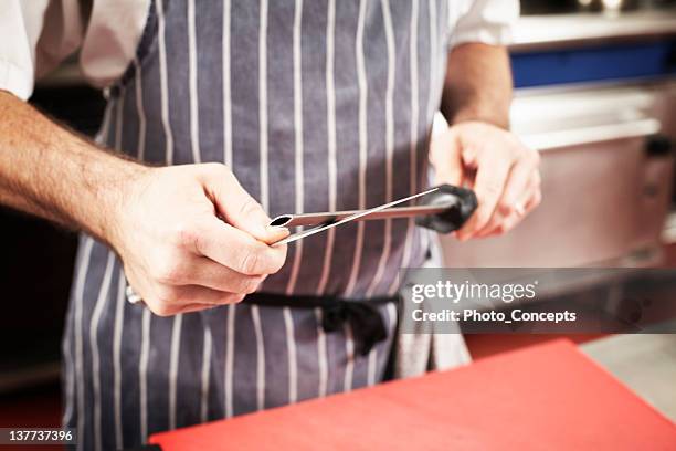 close up of chef sharpening knife - sharpening stock pictures, royalty-free photos & images