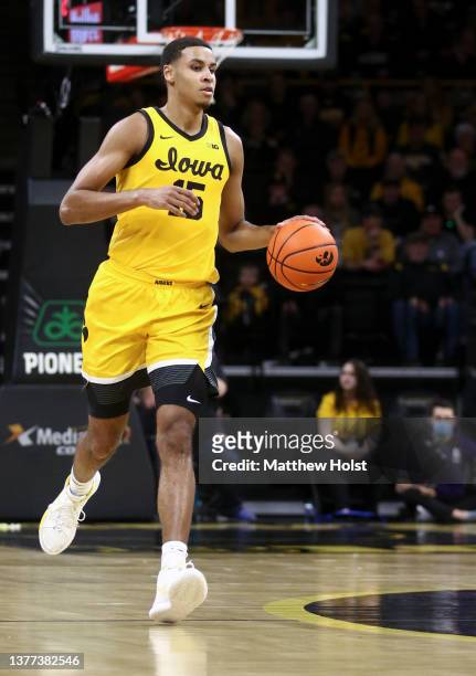 Forward Keegan Murray of the Iowa Hawkeyes brings the ball down the court in the first half against the Northwestern Wildcats at Carver-Hawkeye Arena...