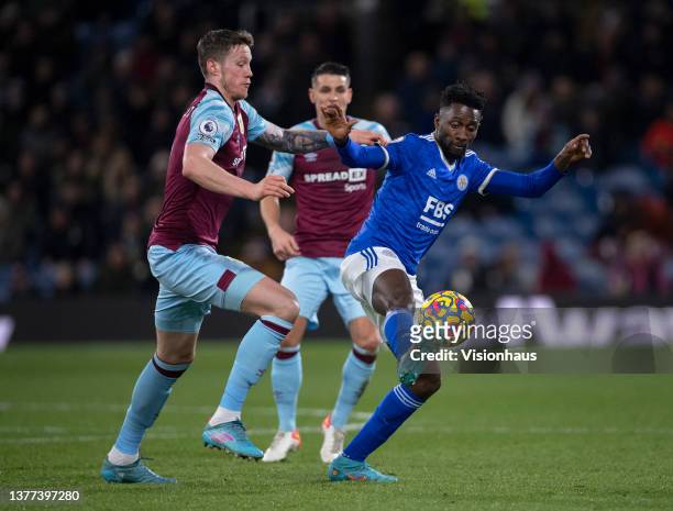 Wout Weghorst and Ashley Westwood of Burnley with Wilfred Ndidi of Leicester City in action during the Premier League match between Burnley and...
