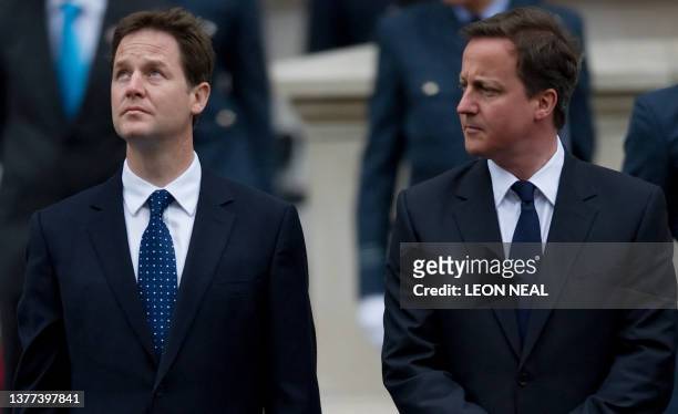 British opposition Liberal Democrat Leader Nick Clegg and British opposition Conservative party Leader David Cameron attend a VE Day memorial service...