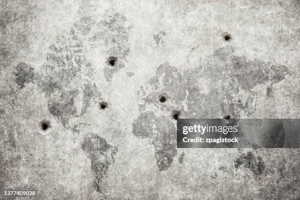 bullet holes in the world map, damaged wall - bullet hole stock pictures, royalty-free photos & images