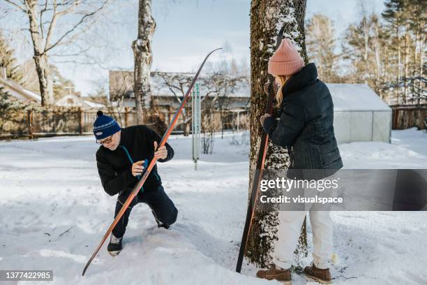 father and daughter waxing and preparing skis - wax stock pictures, royalty-free photos & images