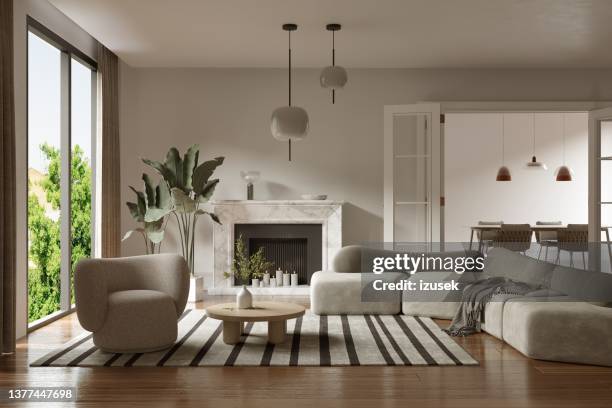 blanket on gray sofa by coffee table at apartment - candle lit living room stock pictures, royalty-free photos & images