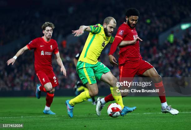 Teemu Pukki of Norwich City shoots past Joe Gomez of Liverpool during the Emirates FA Cup Fifth Round match between Liverpool and Norwich City at...