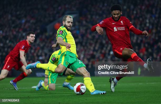 Teemu Pukki of Norwich City shoots past Joe Gomez of Liverpool during the Emirates FA Cup Fifth Round match between Liverpool and Norwich City at...