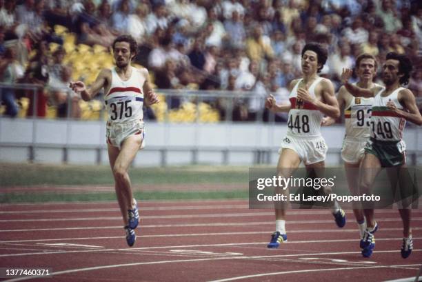 Steve Ovett of Great Britain crosses the finish line in first place ahead of Thomas Wessinghage of West Germany , Fernando Pacheco Mamede of Portugal...