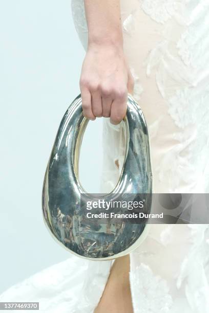 Model, bag detail, walks the runway during the Coperni Womenswear Fall/Winter 2022-2023 show as part of Paris Fashion Week on March 03, 2022 in...