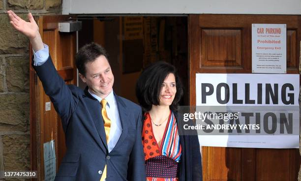 British opposition Liberal Democrat Leader Nick Clegg waves to supporters next to his wife Miriam Gonzalez Durantez after casting his vote at Bents...