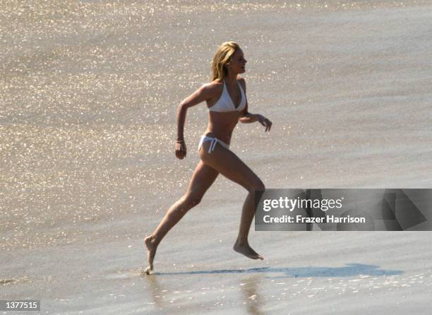 Actress Cameron Diaz runs on the set of her upcoming movie, "Charlie's Angels 2" on September 10, 2002 in Malibu, California.