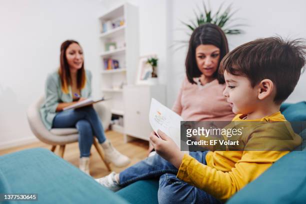 therapy of little child and pregnant mother with educational psychology - autism stock pictures, royalty-free photos & images