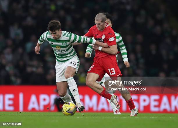 Alex Gogic of St Mirren vies with Matt O'Riley of Celtic during the Cinch Scottish Premiership match between Celtic FC and St. Mirren FC at on March...