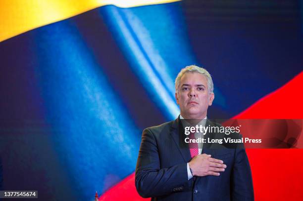 Colombia's president Ivan Duque Marquez sings the national anthem during the inauguration ceremony of the Week of Citizen Security 'Semana de...