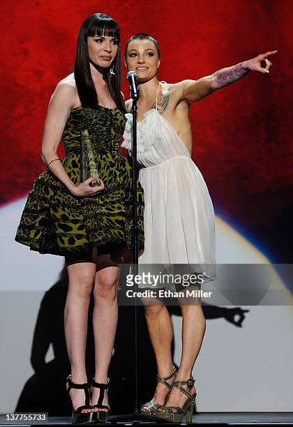 Adult film actresses Dana DeArmond and Belladonna accept an award during the 29th annual Adult Video News Awards Show at The Joint inside the Hard...