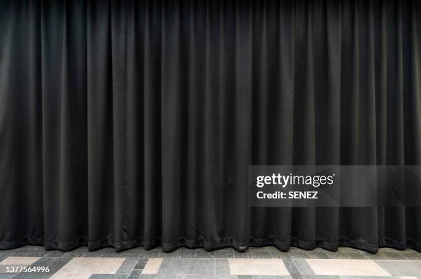 closed black stage curtain - curtains stockfoto's en -beelden