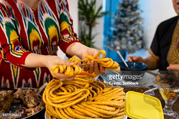 breaking the sangza - breaking bread stock pictures, royalty-free photos & images
