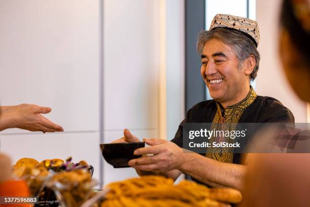 here's your dumpling soup - ramadan giving stockfoto's en -beelden