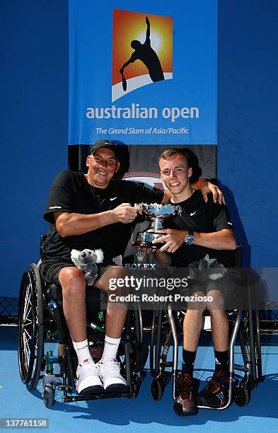 Peter Norfolk and Andrew Lapthorne of Great Britain pose with the winners trophy after defeating David Wagner of the United States of America and...