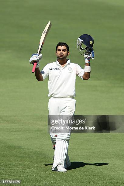 Virat Kohli of India celebrates after passing 100 runs during day three of the Fourth Test Match between Australia and India at Adelaide Oval on...