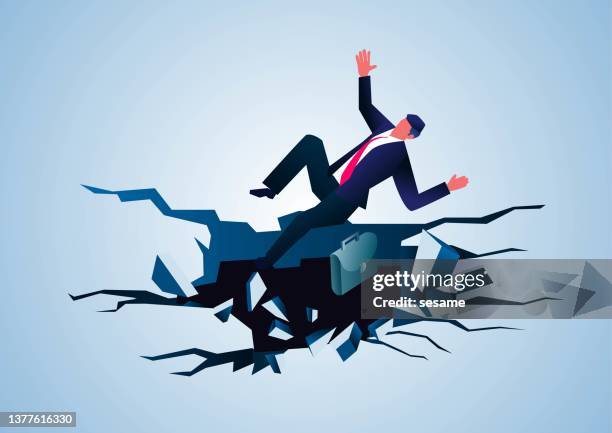 businessman falls into cracked underground cave, business concept illustration - deep hole stock illustrations