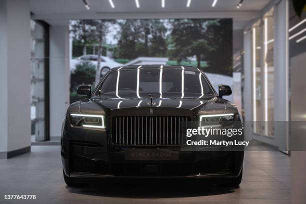 The Rolls Royce Ghost Black Badge seen at HR Owen Rolls Royce in Mayfair, London. The Black Badge series is Rolls Royces bespoke option giving...