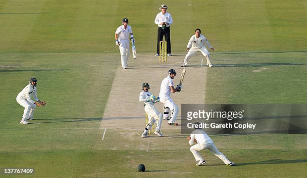 Mohammad Hafeez of Pakistan catches out Kevin Pietersen of England from the bowling of Saeed Ajmal during the second Test match between Pakistan and...