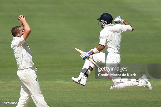 Virat Kohli of India celebrates after passing 100 runs off the bowling of Peter Siddle during day three of the Fourth Test Match between Australia...