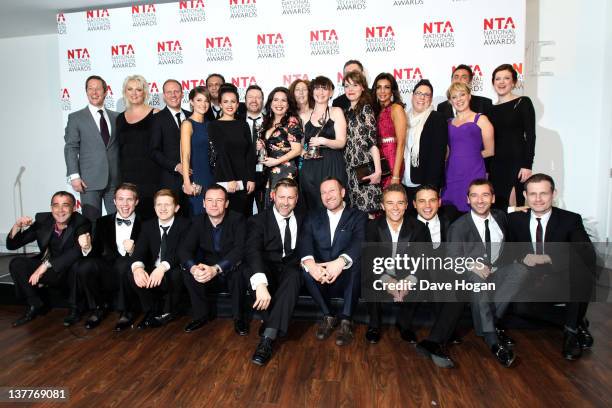 The cast and crew of Coronation Street pose with their Serial Drama Award in the press room at the National Television Awards 2012 at The O2 Arena on...