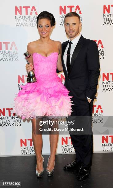 Tulisa Contostavlos and Gary Barlow pose with their best Talent Show Award for X-Factor at National Television Awards 2012 held at the O2 Arena on...