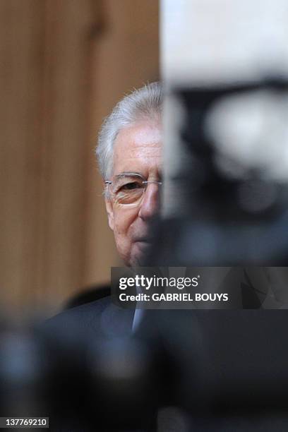 Italian Prime Minister Mario Monti arrives to meet Afghanistan's President Hamid Karzai on January 26, 2012 at Palazzo Chigi, Italy's Prime ministry...