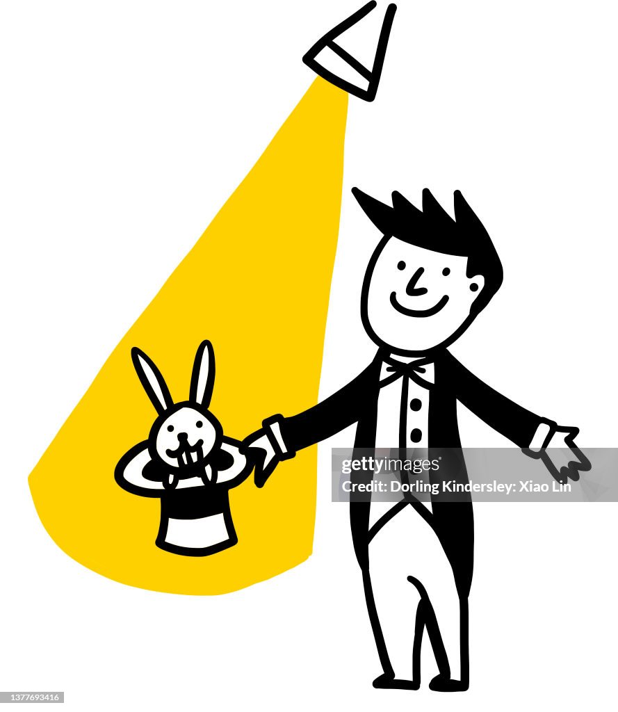 Magician with rabbit and hat under spot light