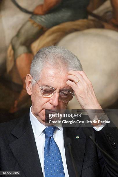 Italian Prime Minister Mario Monti attends a meeting with Afghan President Hamid Karzai to sign a bilateral agreement on cooperation and partnership,...