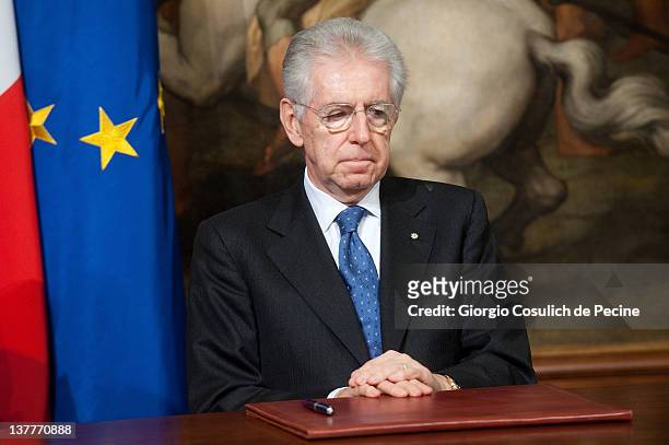 Italian Prime Minister Mario Monti attends a meeting with Afghan President Hamid Karzai to sign a bilateral agreement on cooperation and partnership,...