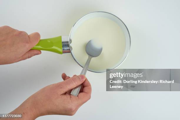 making plastic - holding saucepan stock pictures, royalty-free photos & images