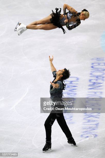 Tatiana Volosazhar and Maxim Trankov of Russia preform on the way to winning the gold medal in the Pairs Free Skating during the ISU European Figure...
