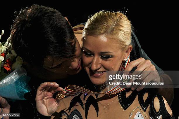 Tatiana Volosazhar and Maxim Trankov of Russia celebrate winning the gold medal in the Pairs Free Skating during the ISU European Figure Skating...