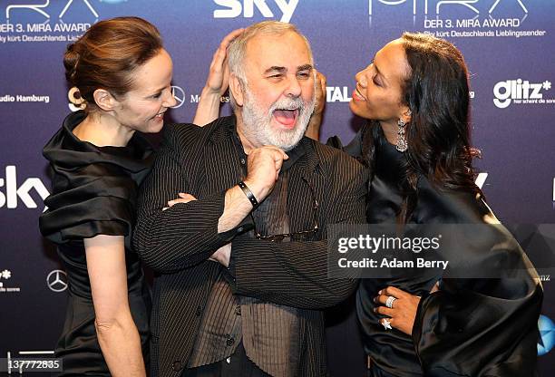 Udo Walz arrives with Jeanette Hain and Barbara Becker for the Mira Awards ceremony at e-Werk on January 26, 2012 in Berlin, Germany. The Mira Award...