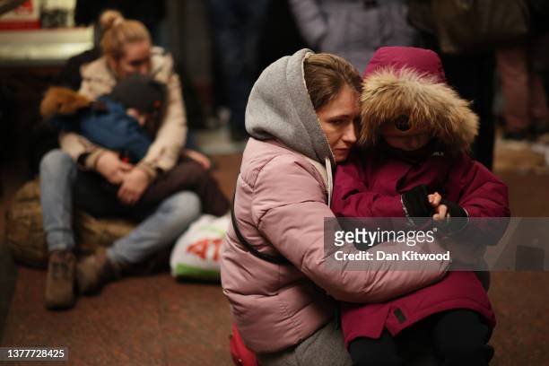 Families wait to board a train to Poland on March 03, 2022 in Lviv, Ukraine. More than a million people have fled Ukraine following Russia's...