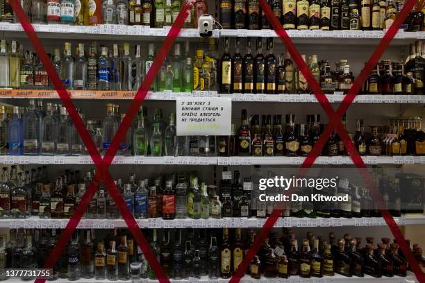 Alcohol is taped up in a supermarket after being banned for purchase on March 03, 2022 in Lviv, Ukraine. More than a million people have fled Ukraine...