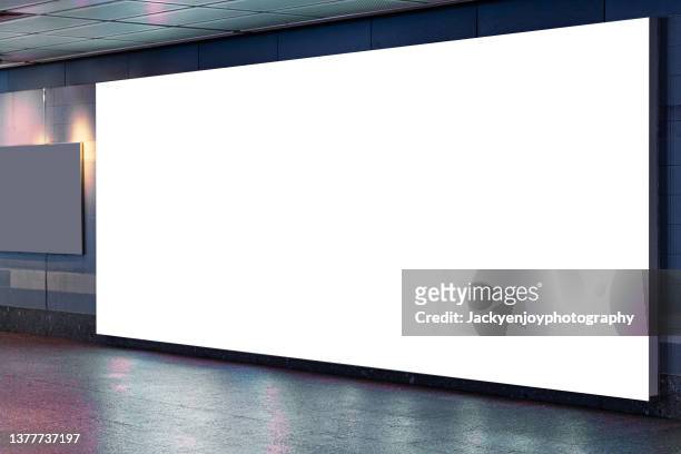 blank billboard on subway - airport outside stockfoto's en -beelden