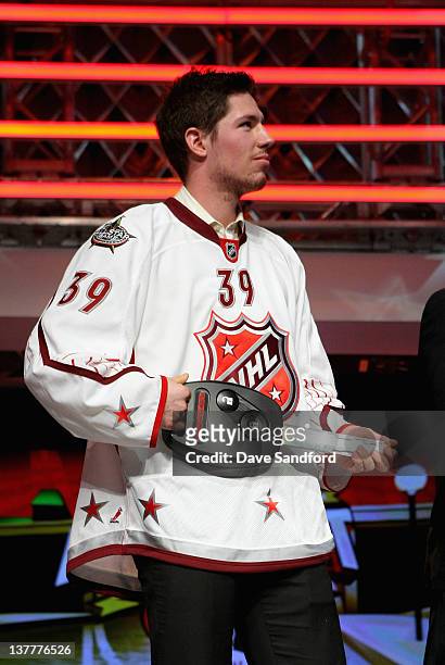 Last pick Logan Couture of the San Jose Sharks and Team Chara stands on stage with a key to his car during NHL All-Star Fantasy Draft at Le Theatre...