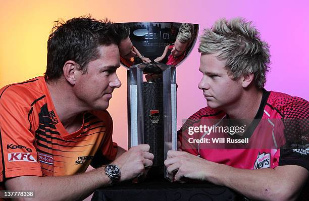 Marcus North of the Perth Scorchers poses with Steve Smith of the Sydney Sixers and the T20 trophy during the Big Bash League Final press conference...