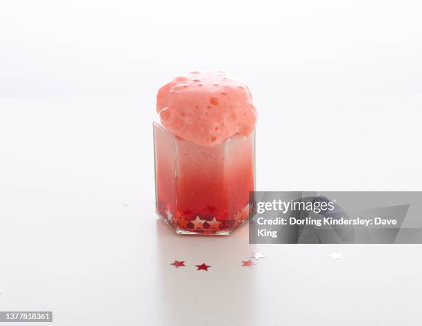 a foaming explosive jar volcano - baking soda stock pictures, royalty-free photos & images