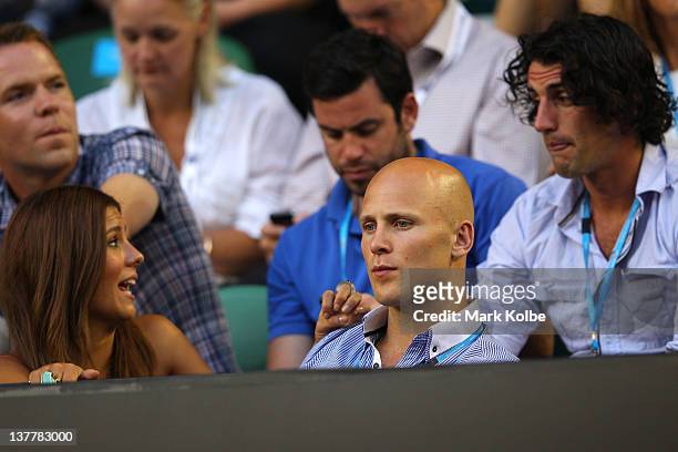 Comedian Andy Lee , Gold Coast Suns' AFL captain Gary Ablett and his partner Lauren Phillips watch the men's semifinal match between Andy Murray of...