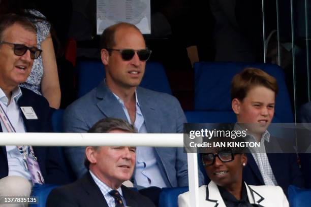 Britain's Prince William, Prince of Wales and his son Britain's Prince George of Wales watch the afternoon session on day four of the second Ashes...