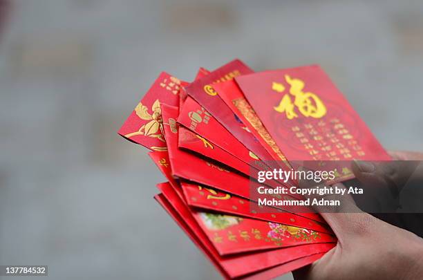 chinese new year ritual - red envelope stock pictures, royalty-free photos & images