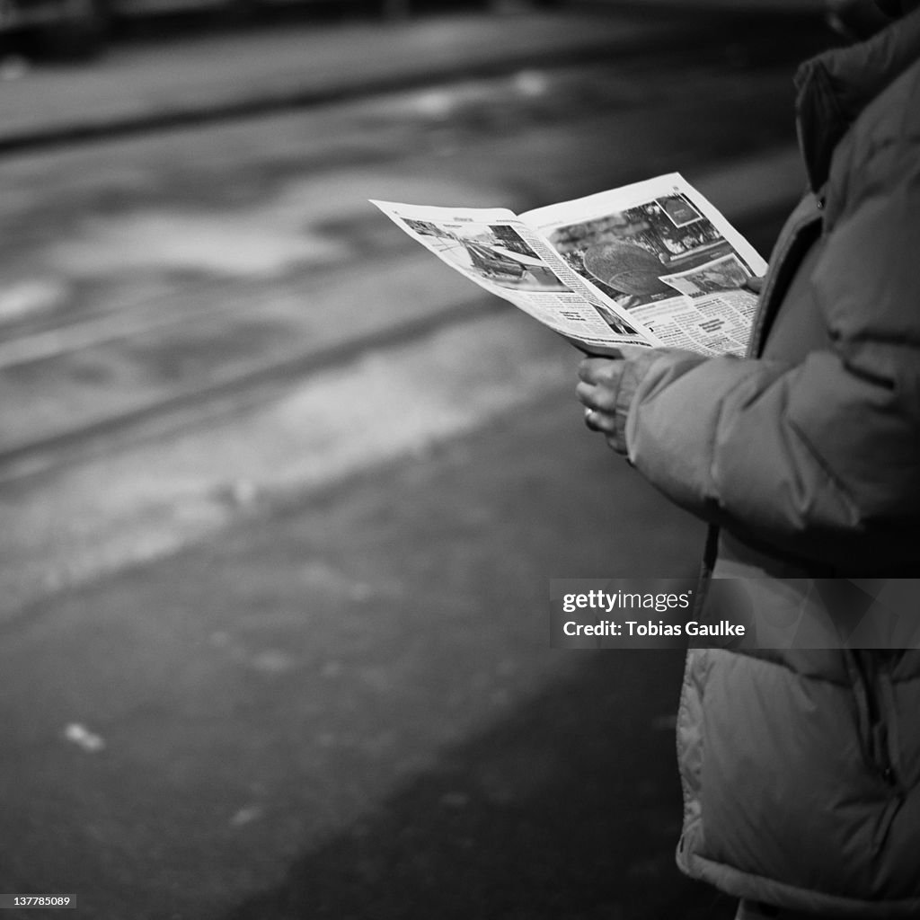 Man reading newspaper