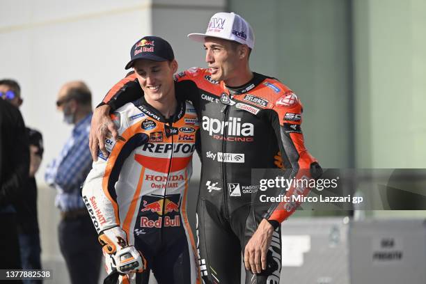 Pol Espargaro of Spain and Repsol Honda Team with his brother Aleix Espargaro of Spain and Aprilia Racing speak in pit before the official photo for...